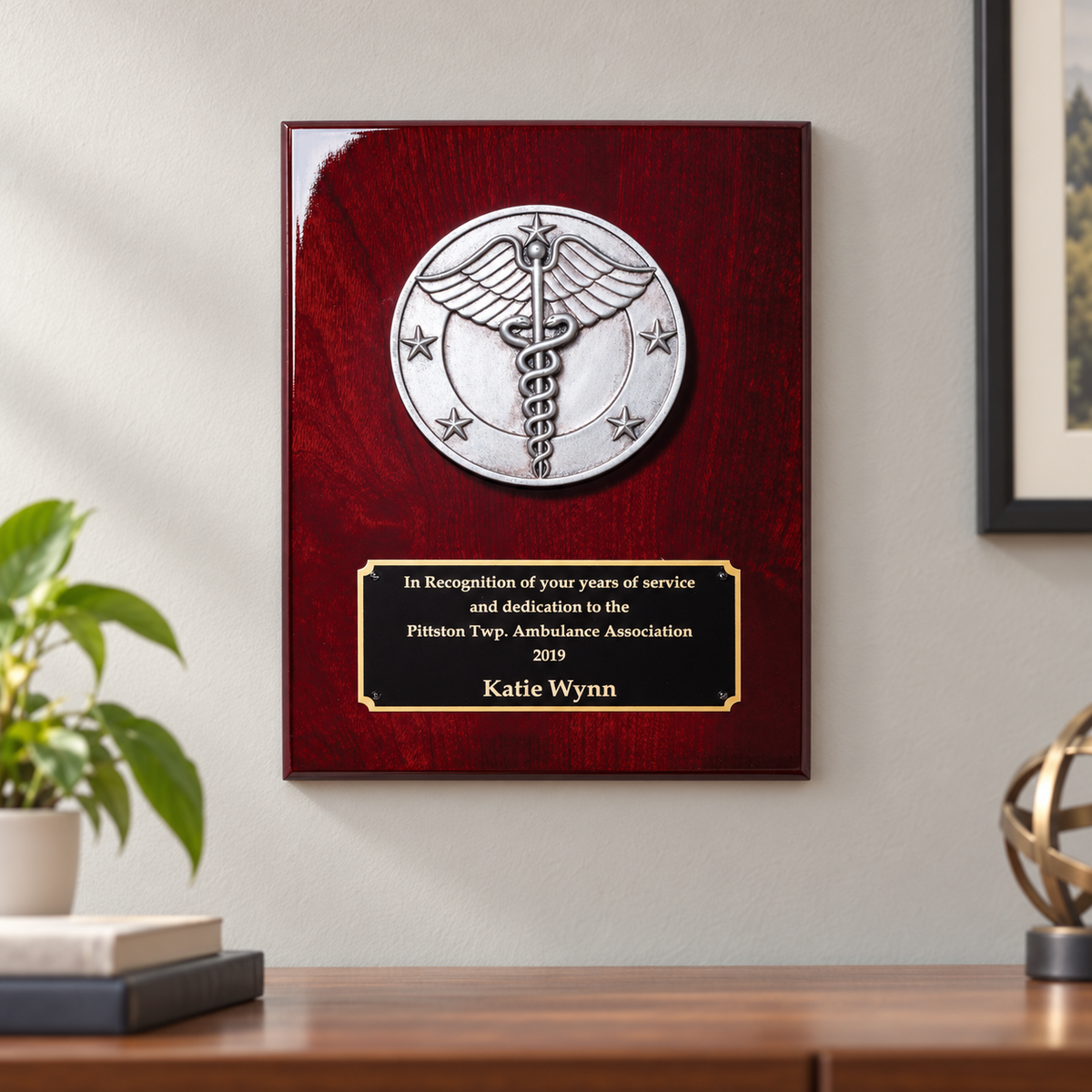 Caduceus Rosewood Piano Finish Plaque — lifestyle photo