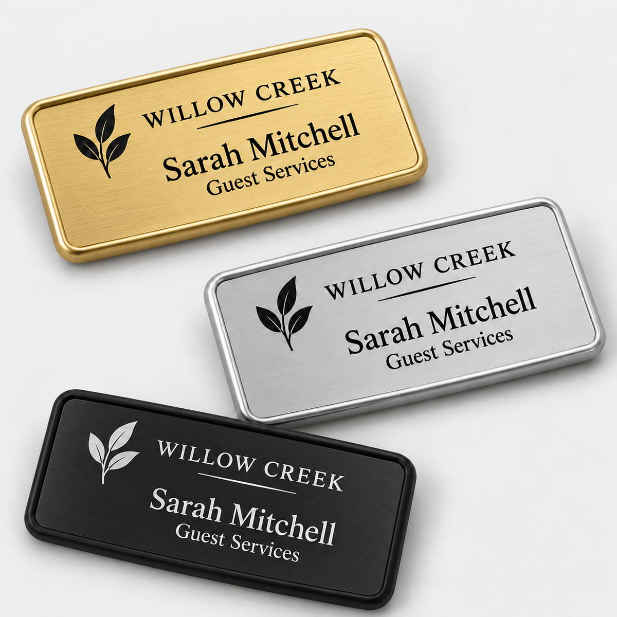Framed metal name badges with gold, silver and black engraved inserts