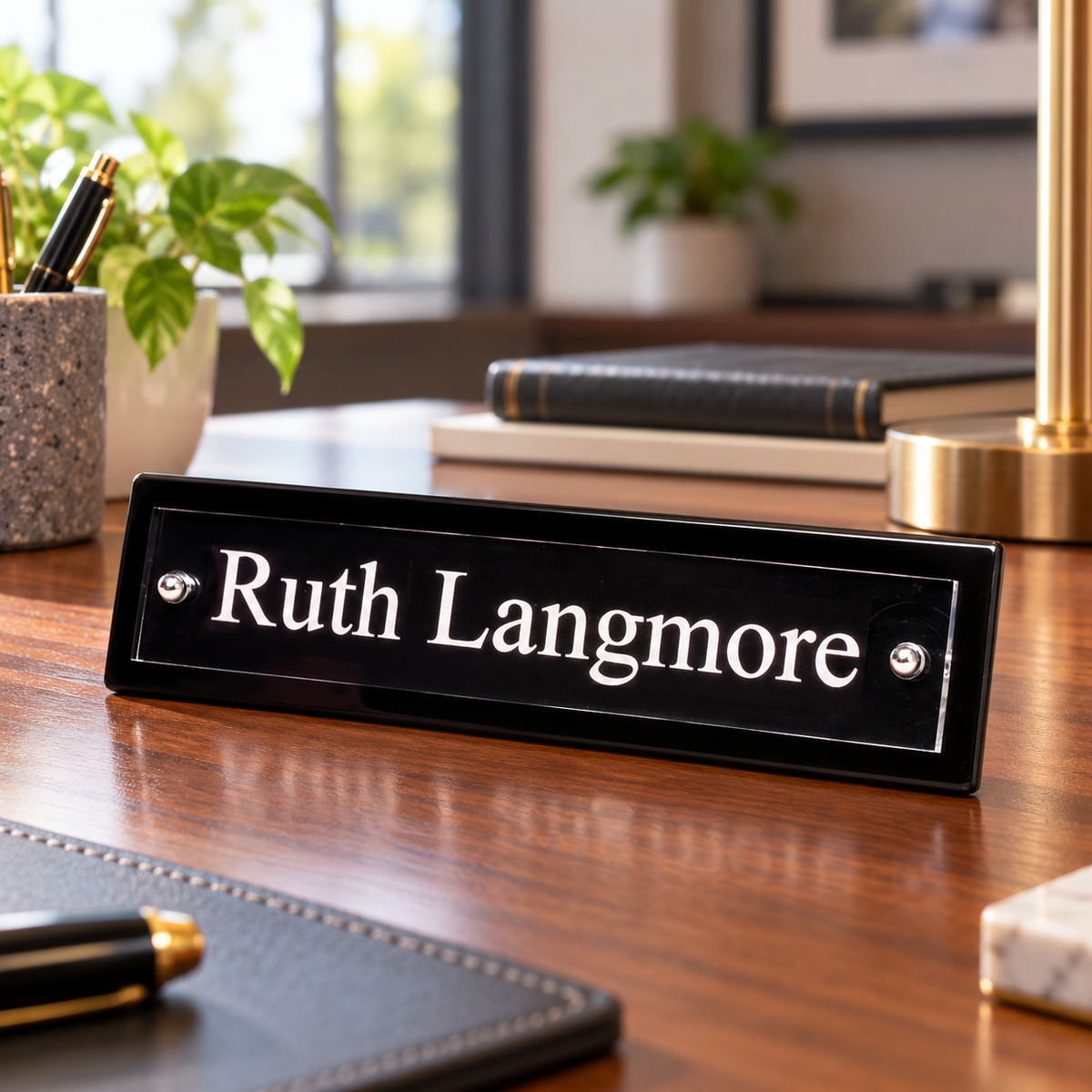 Piano Finish Nameplate with Acrylic Engraving Plate — shown in an office setting