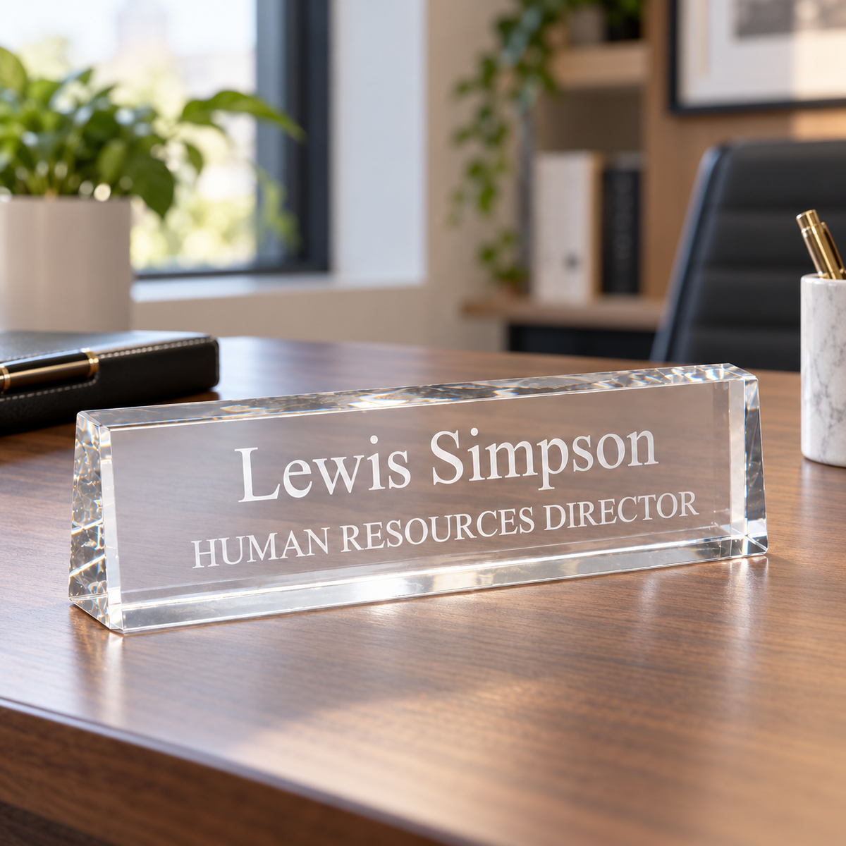 Acrylic Desk Wedge Nameplate — shown on an office desk