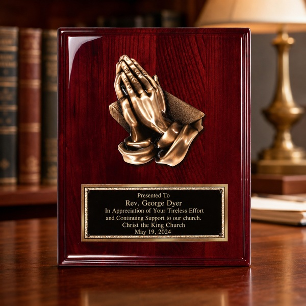 Praying Hands Rosewood Piano Finish Plaque displayed in a realistic setting