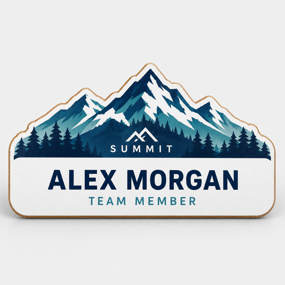Sample custom-shaped hardboard name badge with full-color mountain design