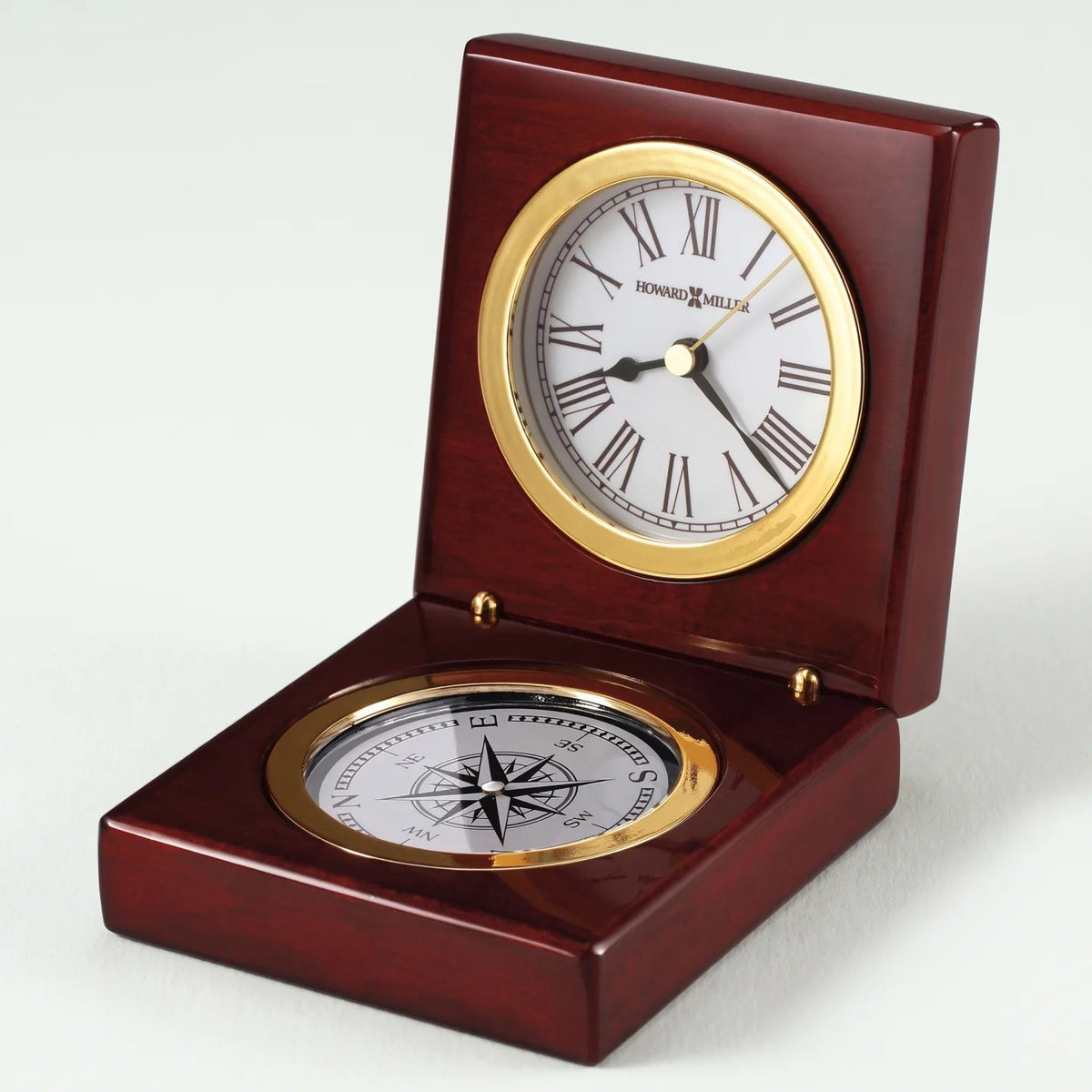 Howard Miller Pursuit tabletop clock in rosewood finish on white background