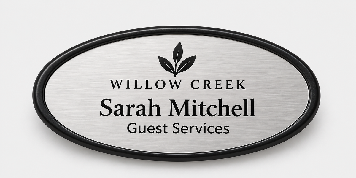 Oval framed plastic name badge — Black frame, 1.5 x 3 insert
