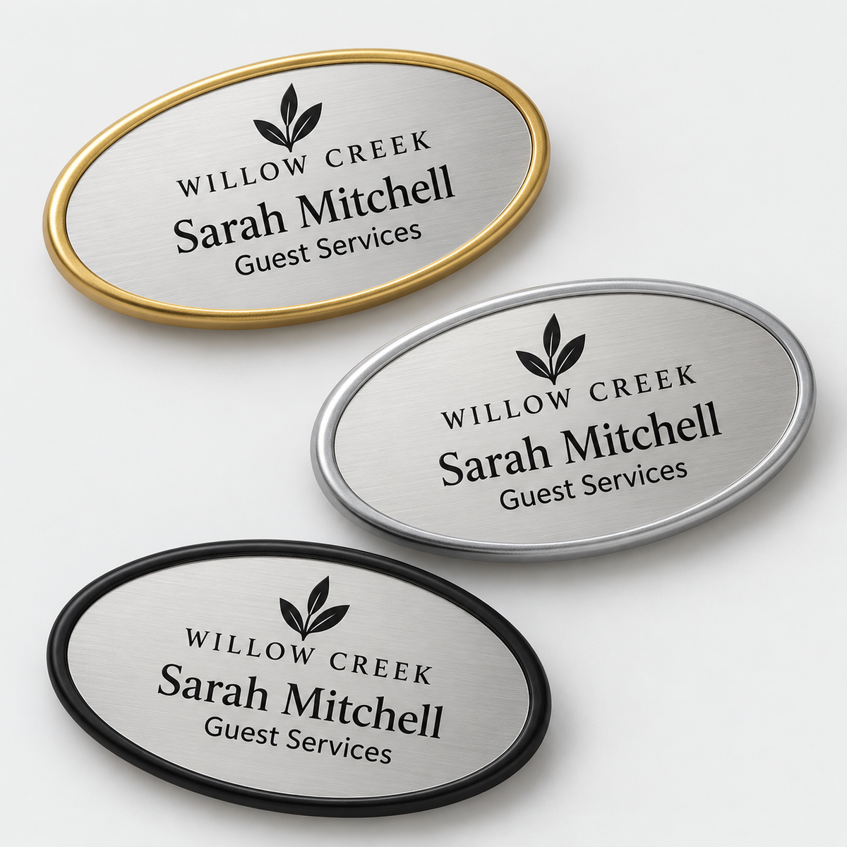 Oval framed engraved plastic name badges — gold, silver and black frame samples